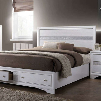 Chrissy White Storage Bed with silver accents, cozy brown bedding, and elegant design in a stylish bedroom setting.