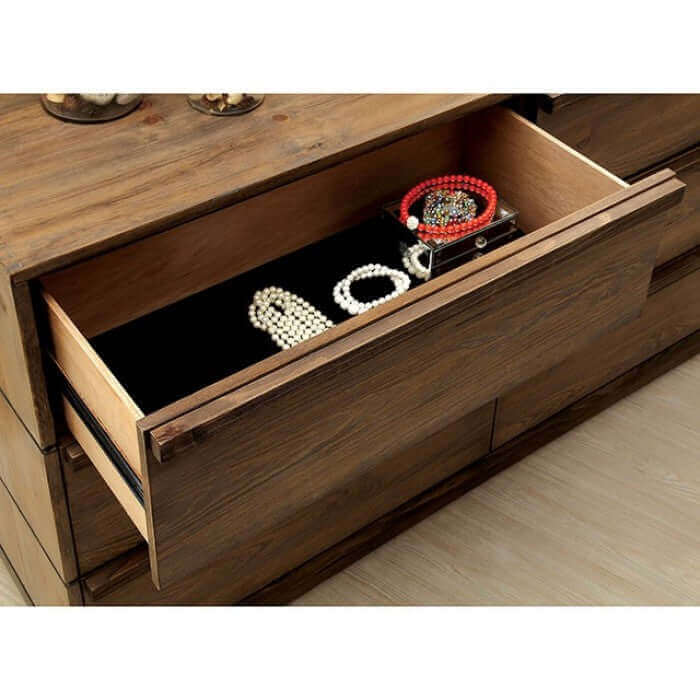 Open drawer of Coimbra Natural Nightstand showcasing jewelry and accessories against a felt-lined interior.