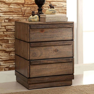 Rustic Coimbra Natural Nightstand with three drawers, wood finish, and decorative accents in a cozy interior setting.