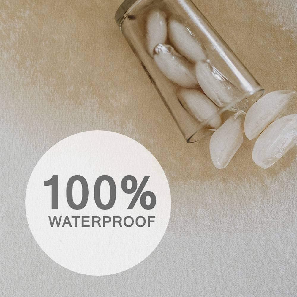 100% waterproof mattress protector featuring ice cubes on a soft terry cloth surface. Ideal for protecting your mattress.