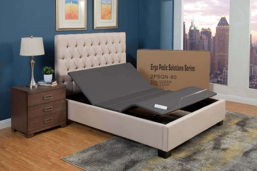 Ergo-Pedic Solutions II Adjustable Bed Base in a modern bedroom setting with a tufted headboard and nightstand.