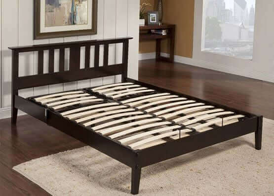 Modern wooden slat bed frame in a stylish room, showcasing durability and support for any mattress.