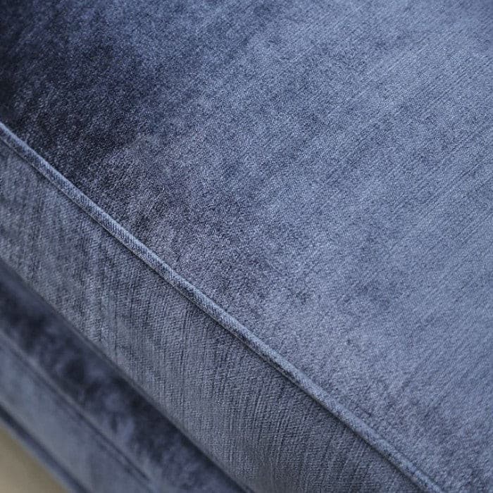 Close-up of the soft satin blue fabric on the Jodie contemporary sofa, showcasing its rich texture and color.