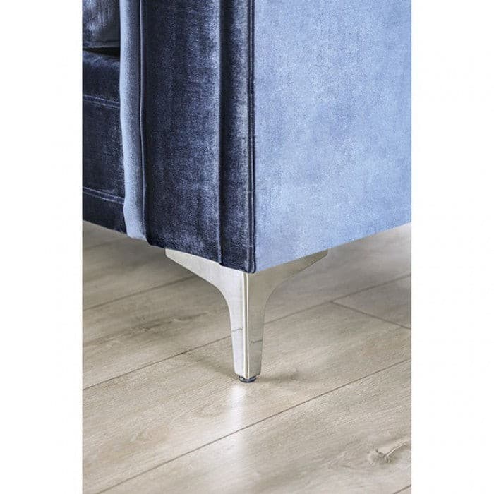 Close-up of Jodie Satin Blue Sofa leg showcasing elegant chrome legs on a wooden floor.