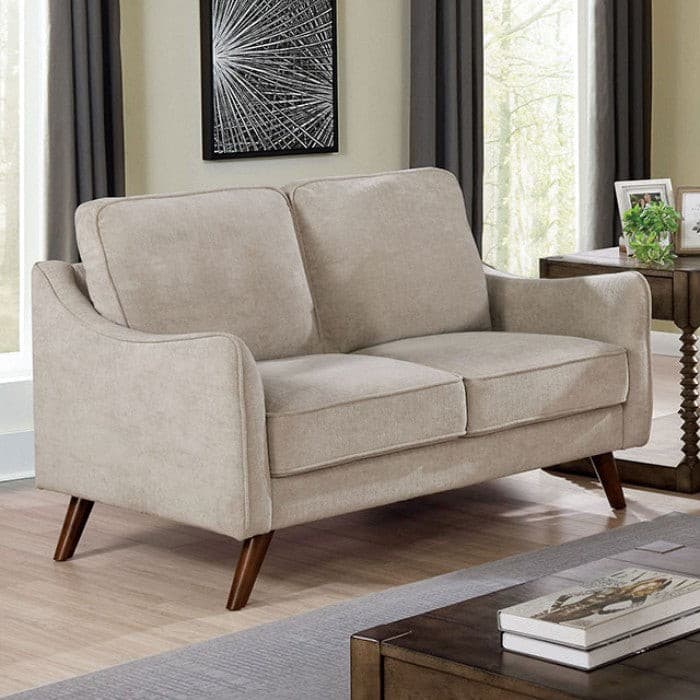 Light gray mid-century modern loveseat with curved arms and tapered legs in a bright living room setting.
