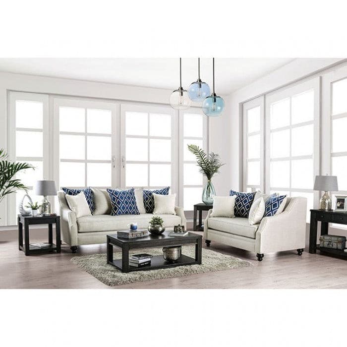 Nefyn Ivory Transitional Sofa set in a bright lounge with decorative pillows and modern lighting. Ideal for cozy chats.