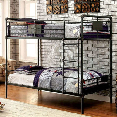 Olga Antique Black Metal Bunk Bed with industrial design, featuring built-in ladder and slat kit, against a brick wall.