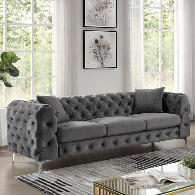 Plush Sapphira dark gray contemporary sofa with tufted arms and chrome legs in a bright living room setting.