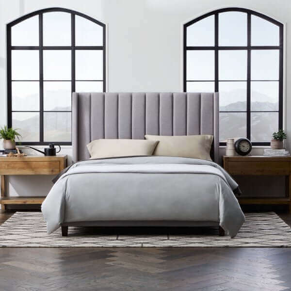 Elegant Malouf Blackwell Stone Headboard with plush vertical channels in a stylish bedroom setting.