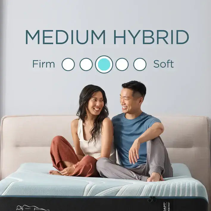 Couple sitting on Tempur-Pedic Medium Hybrid Mattress, highlighting comfort with firm to soft rating scale.