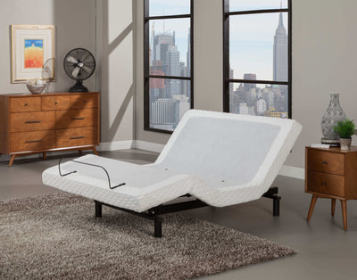 CA King Split Ergo-Pedic Expression Adjustable Base in modern living room setting with city view.