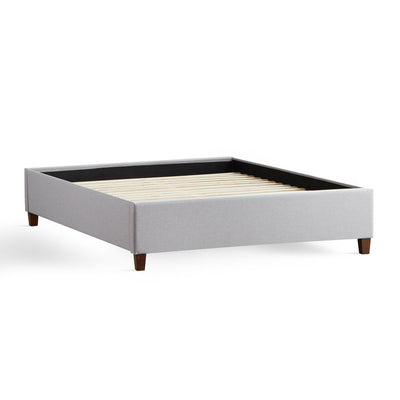 Malouf Eastman Stone Platform Bed Frame with wood-finished legs and soft fabric upholstery, compatible with all mattress types.