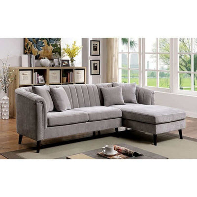 Goodwick Gray Sectional Sofa featuring mid-century design, button tufting, and L-shaped chaise in a stylish living room setting.