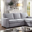 Ines Gray Sectional Sofa in modern living room with clean lines, track arms, and hidden storage for versatile home decor.