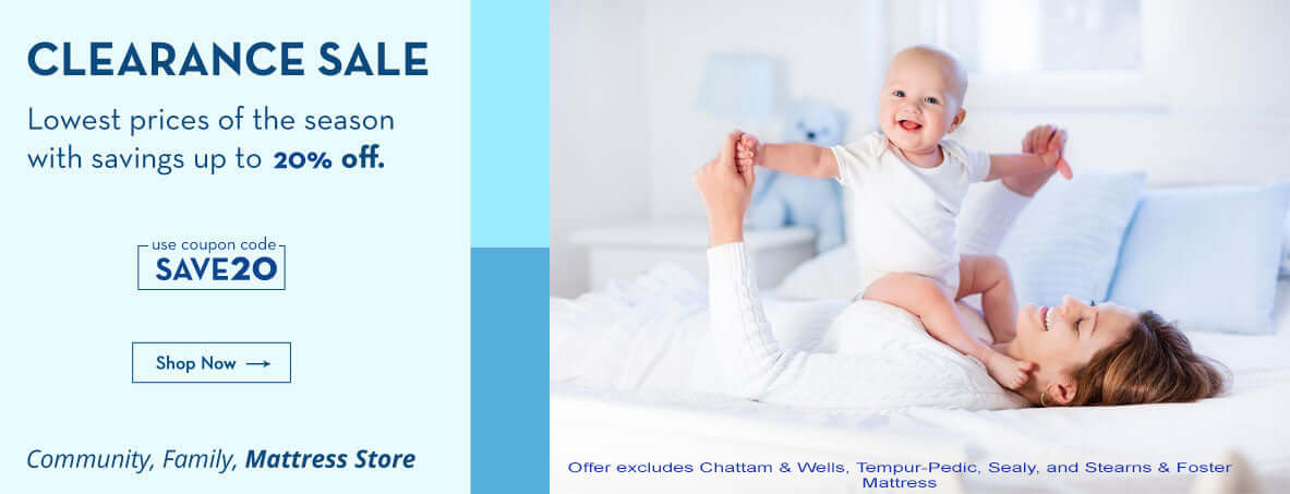 Mother and baby enjoying a clearance sale promotion for mattresses with 20% off savings and coupon code SAVE20.