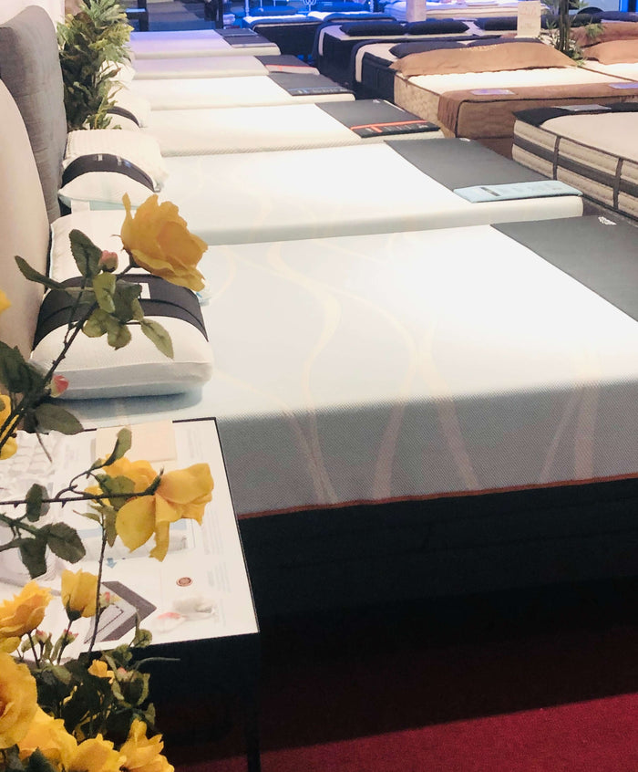 Inside the LA Mattress Studio City showroom mattresses on display