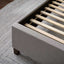 Malouf Eastman Charcoal Platform Bed Frame showcasing wood slats and soft fabric upholstery on a stylish rug.