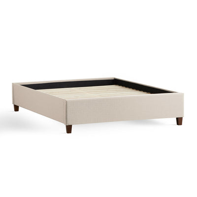 Malouf Eastman Oat Platform Bed Frame with wood-finished legs and soft fabric upholstery, compatible with all mattress types.