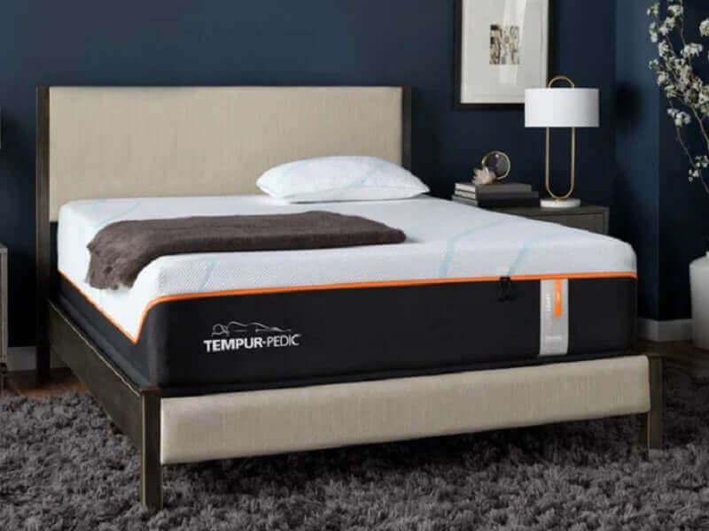 Twin XL Tempur-Pedic TEMPUR-LuxeAdapt® 13" Firm mattress showcased on stylish bed frame in a modern bedroom setting.