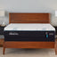 Tempur-Pedic TEMPUR-Adapt 11" Medium Hybrid Mattress displayed on a wooden bed frame with nightstands.