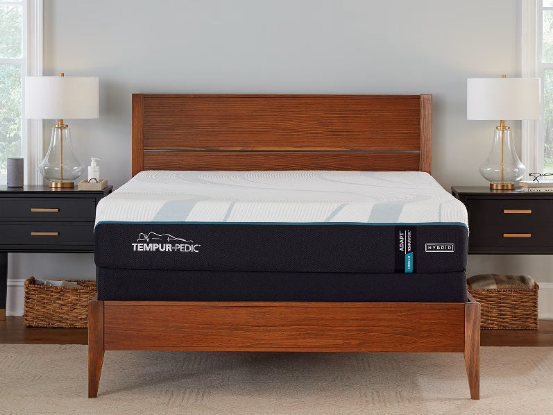 Tempur-Pedic TEMPUR-Adapt 11" Medium Hybrid Mattress displayed on a wooden bed frame with nightstands.