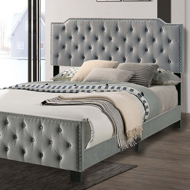 Charlize Gray Tufted Bed with deep button tufting and nailhead trim, showcasing luxury and comfort in a stylish bedroom setting.