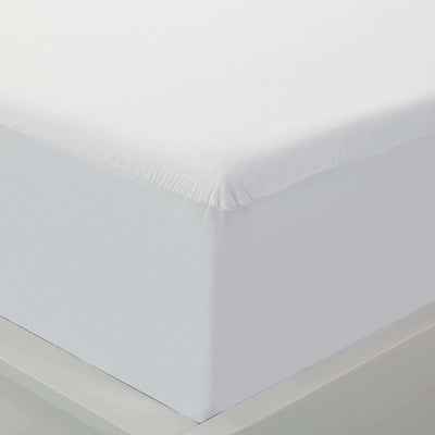 Close-up of a Cool Tencel Waterproof Mattress Protector by PROTECT-A-BED® on a mattress, showcasing its sleek white design.
