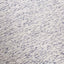 close-up view of textured soft carpet with a beige and navy blue pattern, suitable for interior decor.