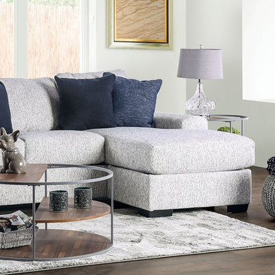 Eastcote Gray Sectional Sofa featuring a chaise, decorative pillows, and stylish accent table in a modern living room setting.