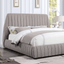 Sherise Bed in contemporary gray boucle fabric with vertical pleating, offering a warm, textured design for modern bedrooms.