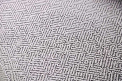 Close-up of the Skyline Pewter Gray loveseat fabric featuring an elegant geometric pattern.