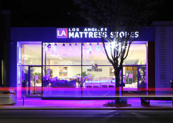 Studio City LA Mattress Store glowing storefront on Ventura Blvd at night