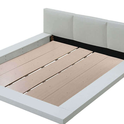 Christie White modern platform bed with sleek design and low-profile headboard, showcasing minimalist style and wooden slats.