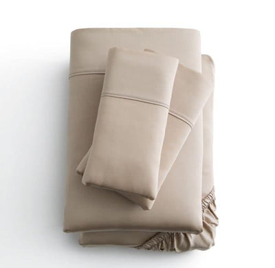 Malouf Ecru Botanical Tencel™ Lyocell Sheet Set with fitted and flat sheets arranged neatly.