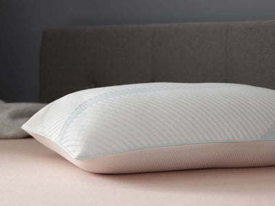 Tempur-Adapt ProLo Cooling Pillow by Tempur-Pedic on a bed, featuring adaptive TEMPUR material for personalized comfort.