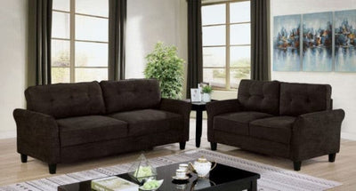 Alissa Brown Fabric Tufted Loveseat and sofa set in a bright living room with large windows and decorative artwork.