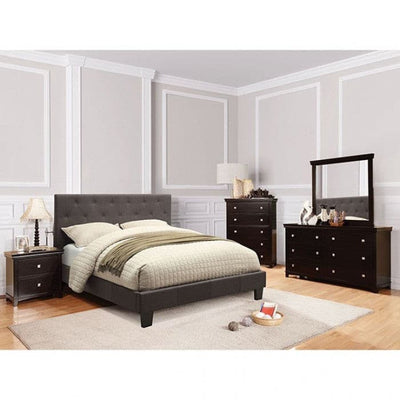 Elegant gray platform bed with button-tufted headboard in a stylish bedroom setting with matching furniture.