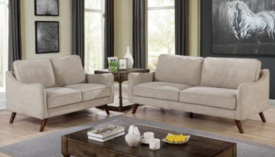 Mid-century modern light gray loveseat with tapered legs, placed in a stylish living room setting.
