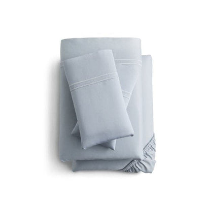 Malouf Premium Smoke Natural Supima® Cotton Sheet Set stacked in a light blue color, featuring extra-deep fitted sheets.