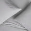 Light gray Supima® cotton pillowcase set on a bed, showcasing the luxurious sateen weave and extra-deep fit.