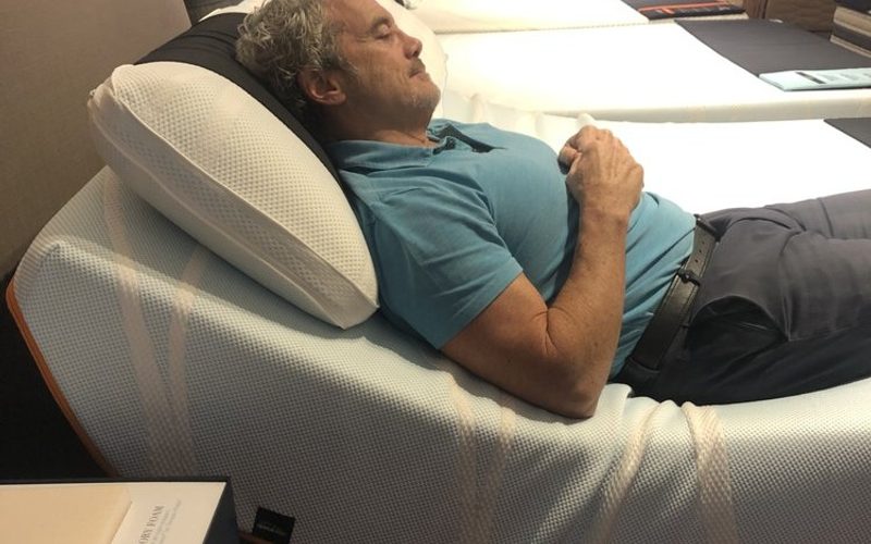 Customer testing an adjustable base at LA Mattress Store