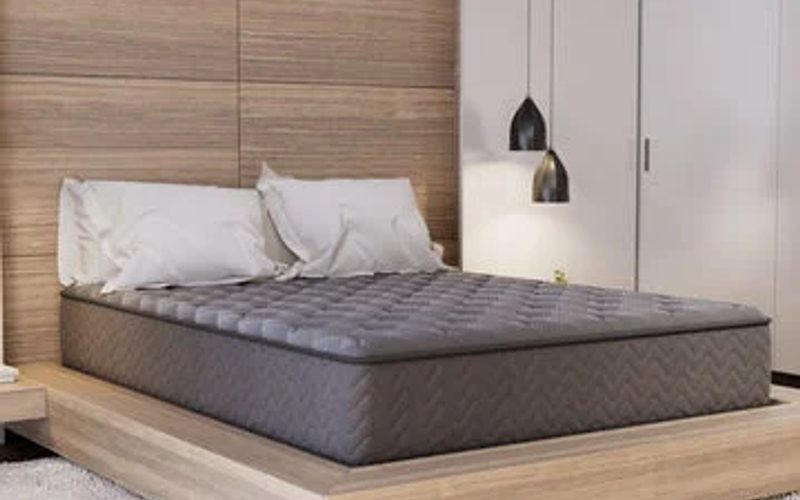 Modern mattress on a minimalist platform bed in a contemporary bedroom