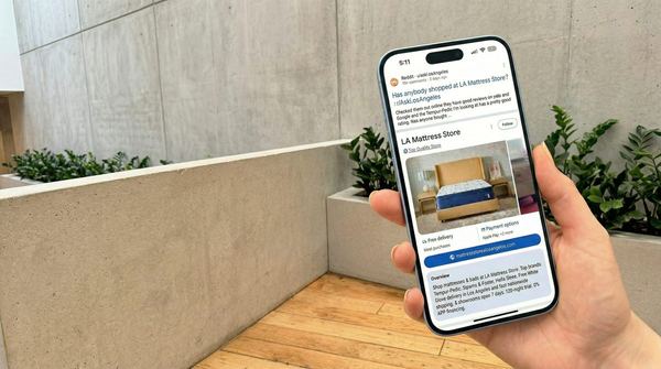 LA Mattress Store Google reviews shown on a phone with a 4.9 star rating